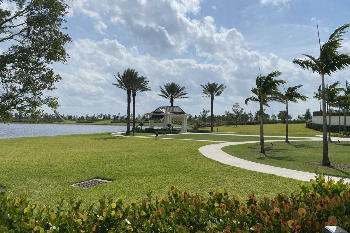 view of outdoor sitting area by community pool in arden loxahatchee fl