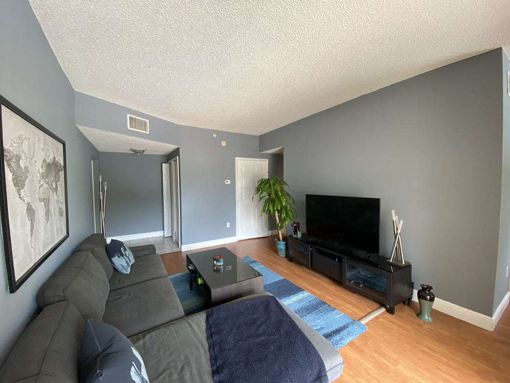 View of the living room in a 3 bedroom floor plan in University Parc Residence Condominium Davie Florida