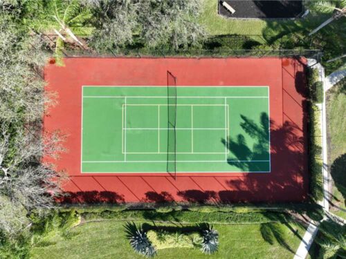 Aerial View Of the community Tennis Courts located in The Club Condominium community in St Lucie West